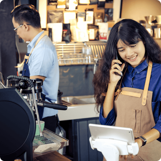 asian-barista-talking-order-by-phone-her-shop 1