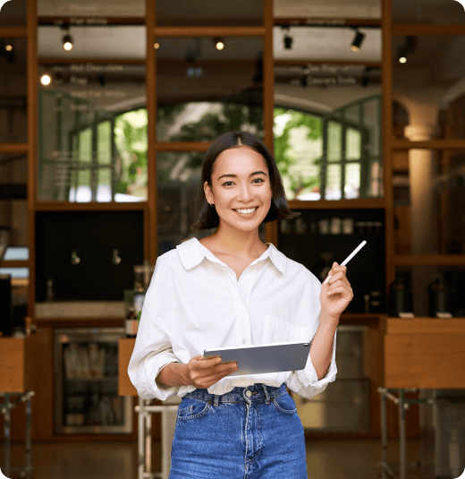 portrait-asian-woman-manager-standing-with-tablet-front-cafe-entrance-welcomes-guests 1